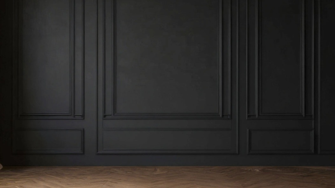 Dark paneled wall with herringbone floor